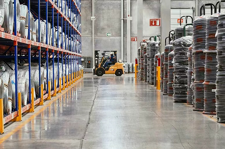 Forklift handling warehouse operations for OEM wire harness, power connectivity and LED products supporting global industrial and electronic manufacturing supply chains.